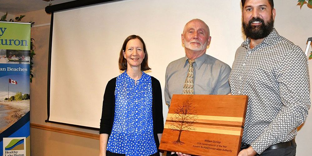 Angela Van Niekerk; ABCA Chair Ray Chartrand; and award winner William Dunlop.
