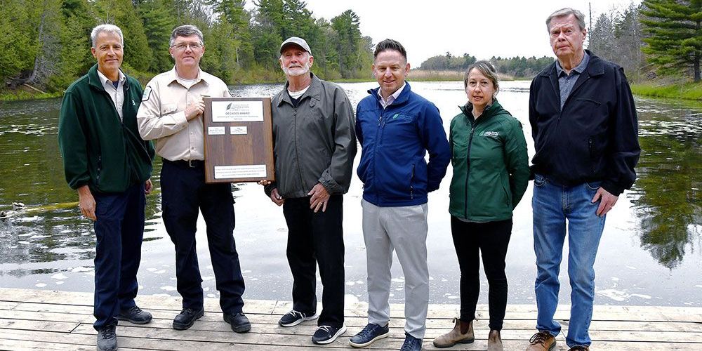 Mark Custers and Alistair Mackenzie accept Decade Award on behalf of Ontario Parks and Pinery Provincial Park.