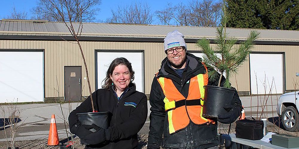 Upper Thames River Conservation staff with trees.